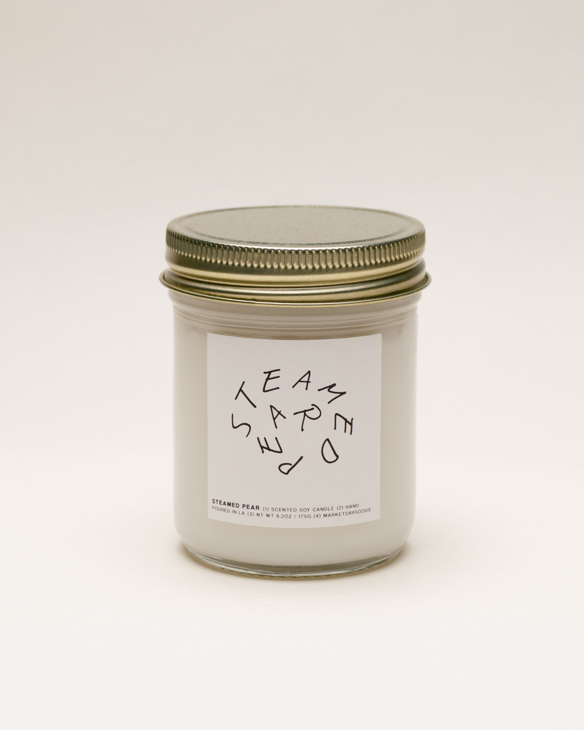 steamed pear soy candle with notes of asian pear, pink petals and amber